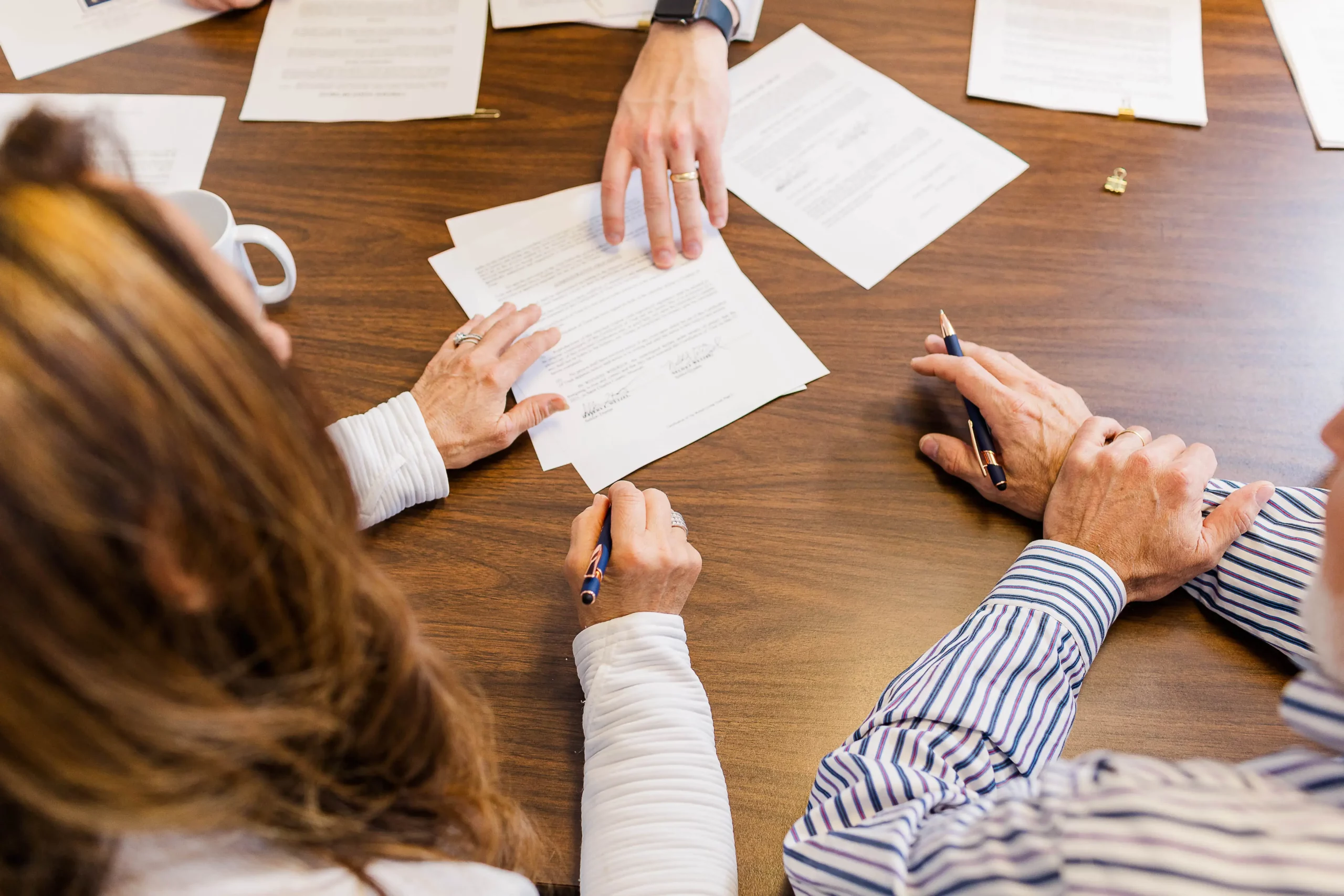 couple signing estate planning documents